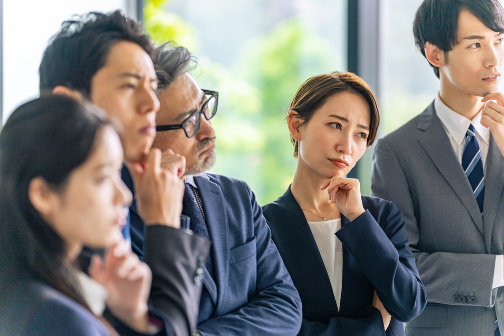 Businesswoman consulting with advisors about overseas expansion